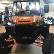 POLARIS RZR TURBO X quad  wersja Sport dodatkowe orurowanie klatki sportowe pasy bezpieczeństwa oświetlenie led na dachu przedni zderzak metalowy kolor pomarańczowy felgi bedlock pełne drzwi orurowane atv progi boczne sportowe zawieszenie Korbanek.pl