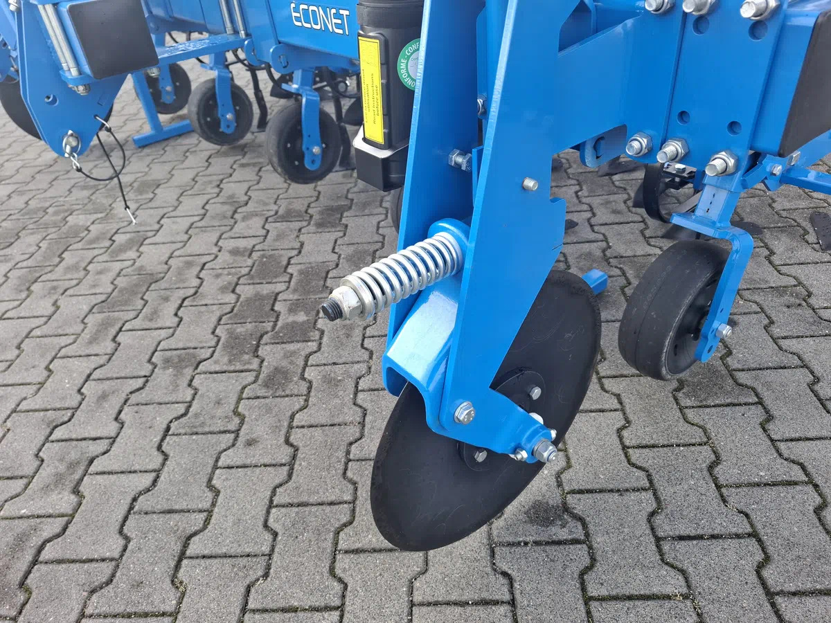 Krój talerzowy układu prowadzenia - zabezpieczenie sprężynowe