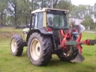 Używany ciągnik rolniczy Same Hurlimann 6135xb z zamontowanym pługiem 