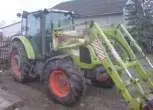 Claas Axos 330C traktor z ładowaczem o mocy 90 KM