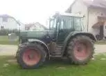Ciagnik marki Fendt seria 312 wyposażony w ladowacz Stoll widok na lewy bok ciągnika 