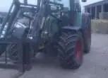 Używany traktor rolniczy Fendt 412 Vario z zamontowanym Stoll Robust z wydłami do palet 