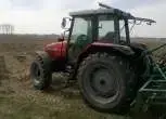 rolniczy ciągnik używany Massey Ferguson 8240 zdjęcie z lewego boku 