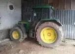 Widok z boku ciągnika John Deere 6410 używanego .