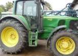 Widok z boku ciągnika John Deere 6920 używany.