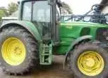 Widok z boku ciągnika John Deere 6920 używany.