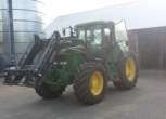 Zdjecie przedstawijace ciągnik JOHN Deere z ładowaczem używany .