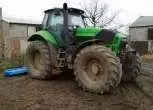 PRawy bok zielonego używanego ciagnika rolniczego Deutz Fahr X 710 