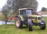 Ciagnik rolniczy Same Hurlimann 6135xb z zamontowany 4 - skibowym pługiem  
