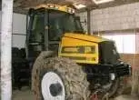 Prawy bok żółtego używanego JCB Fastrac 1135 ciągnik z 1997 roku 