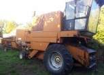kombajn zbożowy Bizon Z 056 1988 r używany w dobrym stanie technicznym z kabiną hederem i wózkiem transportowym