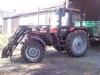 Używany traktor rolniczy MTZ 1025z zamontowanym ładowaczem czołowy Hydramet Tur i przyczepą 